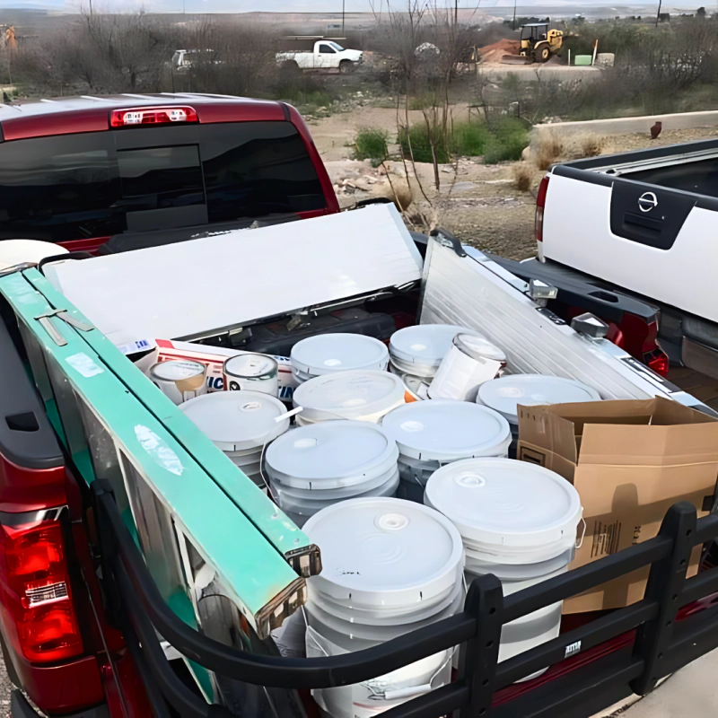a truck loaded with paint containers ready for dispatch